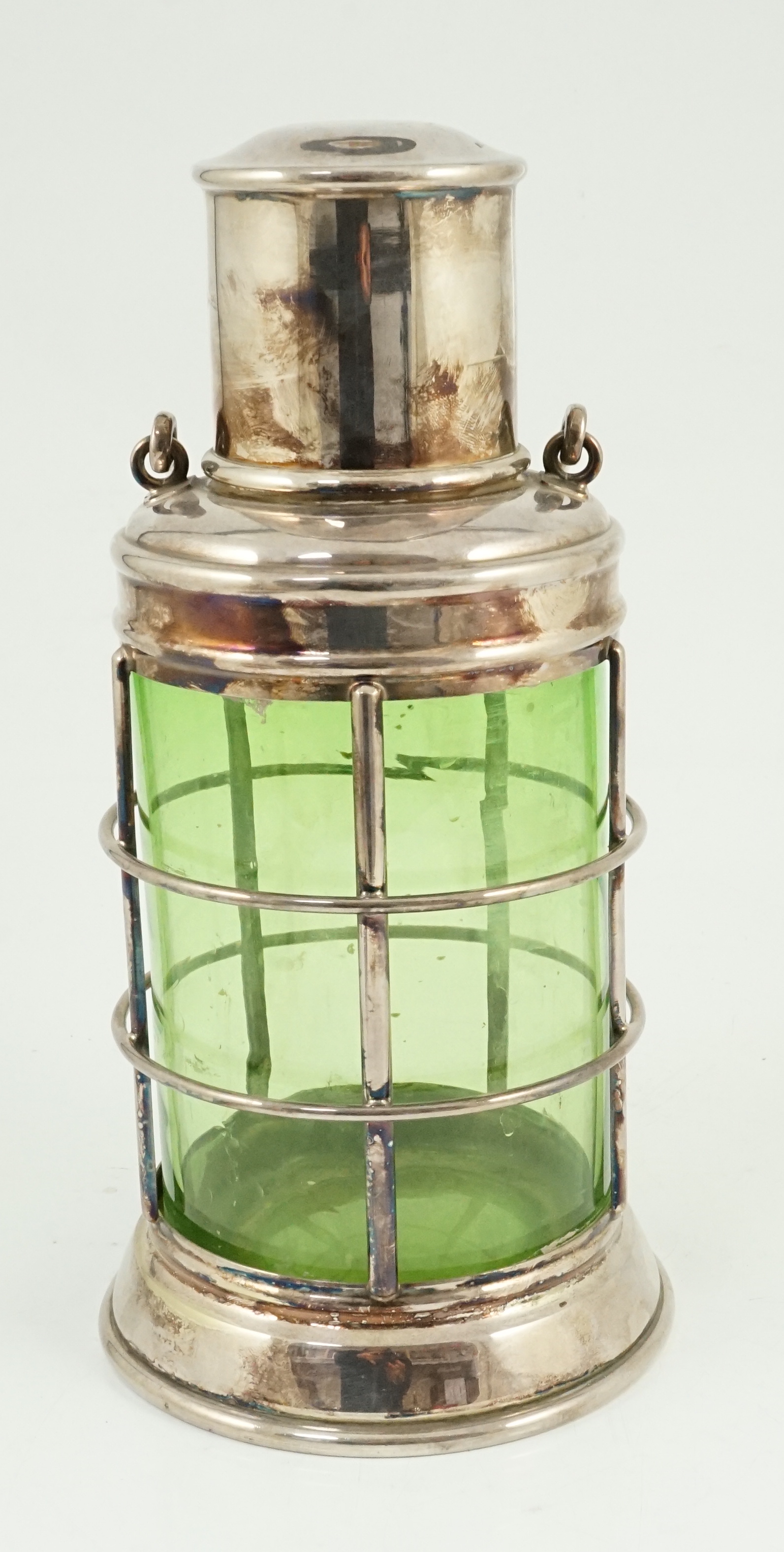 An Asprey & Co. silver plated and green glass novelty cocktail shaker in the form of a lantern